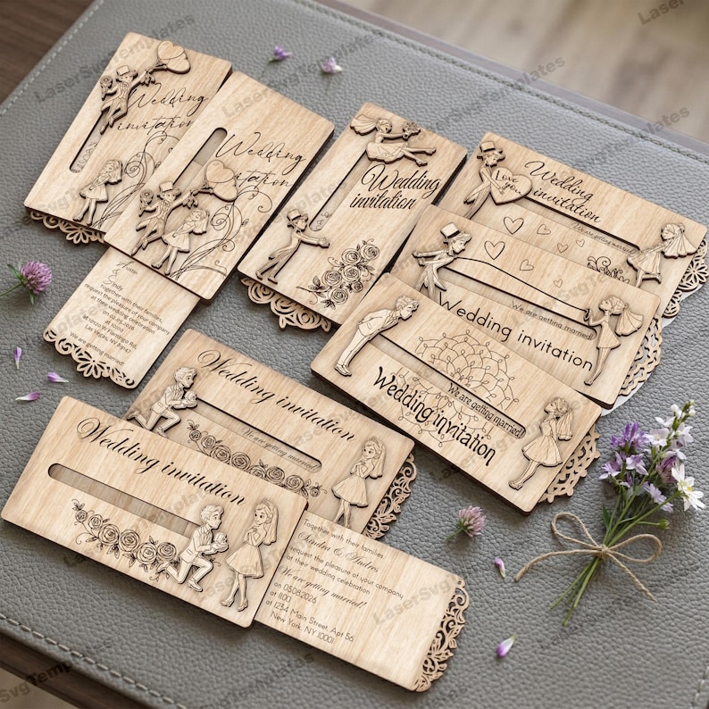 May include: A collection of laser-cut wooden wedding invitations. Each invitation features intricate designs of couples, floral elements, and the words "Wedding Invitation." The invitations are light brown with decorative edges.