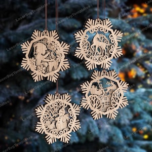 May include: Four wooden snowflake ornaments with intricate cutouts. Each snowflake features a different winter scene, including a girl reading a book, a reindeer, a snowman, and a sleigh ride.