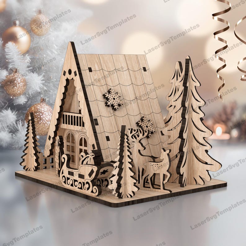 May include: A wooden Christmas village scene with a gingerbread house, two pine trees, and a reindeer pulling a sleigh. The house has a white snowflake on the roof and a balcony. The sleigh is filled with presents.