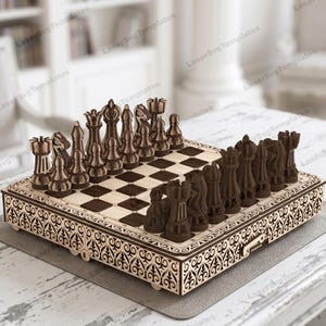 May include: A wooden chess set with intricately carved pieces and a decorative border. The chessboard features dark brown and light brown squares. The pieces are arranged on the board, ready for play. The set is displayed on a light-colored surface.
