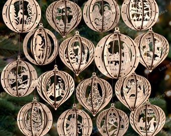May include: A collection of intricately designed wooden Christmas ornaments. Each ornament features a unique cutout design, including angels, nativity scenes, and Christmas trees. The ornaments are suspended against a blurred green background.