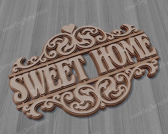 以下が含まれることがあります： 複雑なスクロールワークと「SWEET HOME」という文字が重ねられた3Dスタイルで書かれた木製看板