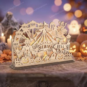 May include: A laser-cut wooden Halloween decoration featuring a carnival theme with a clown, a Ferris wheel, ghosts, and pumpkins. The design includes a sign that reads 'CARNIVAL HELL' and 'PETS', with intricate cutouts that allow light to pass through.