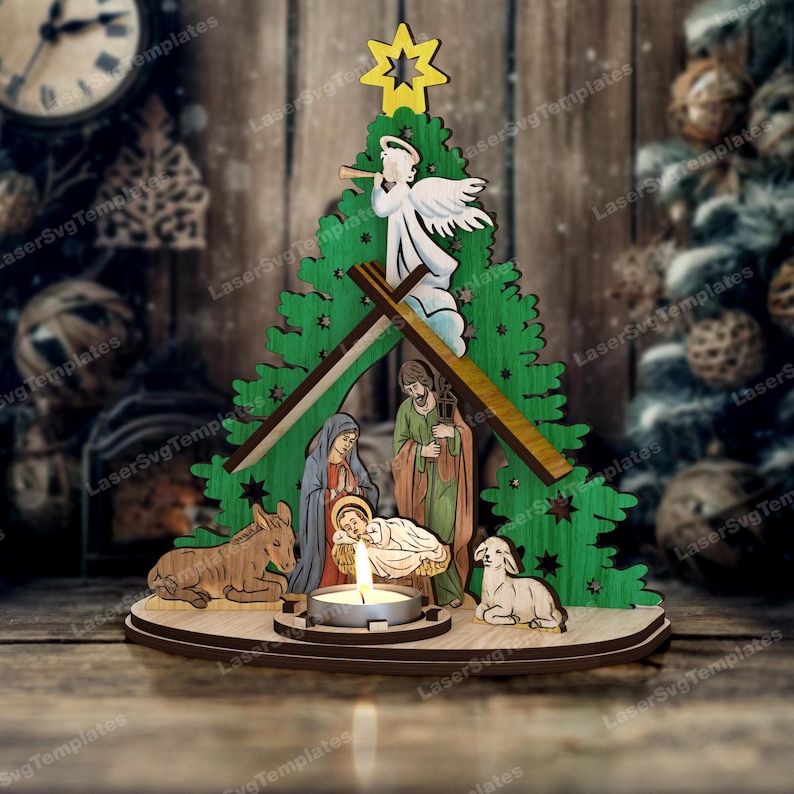 May include: A wooden Christmas nativity scene with a green tree, a yellow star, and figures of Mary, Joseph, and baby Jesus. A candle is lit in front of the figures. A wooden donkey and lamb are also present.