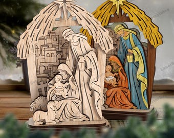 May include: Two wooden nativity scene figurines. One is unpainted, the other is painted with yellow, blue, and orange. Each features a star on top and depicts the holy family in a stable setting. The figurines are on a wooden base.
