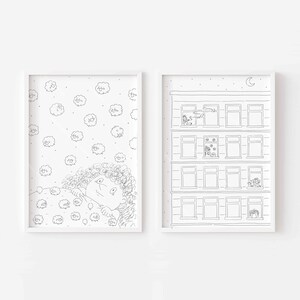 May include: Two framed black and white art prints. One print features a person with curly hair looking at cloud-like shapes. The other print depicts a building with windows, with figures and objects in the windows, under a night sky with a crescent moon.