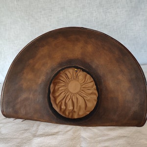 Close up of genuine brown leather texture on handmade pirate hat