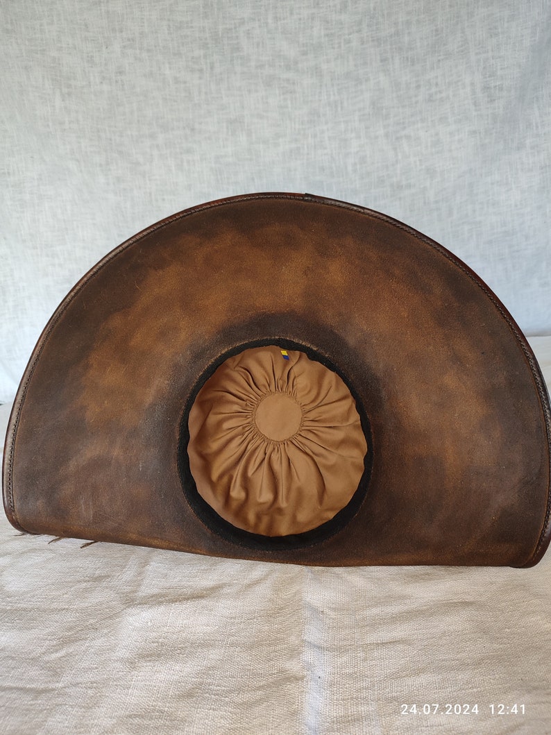 Close up of genuine brown leather texture on handmade pirate hat