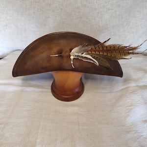 Handmade brown pirate leather hat with wide brim, genuine leather, front view