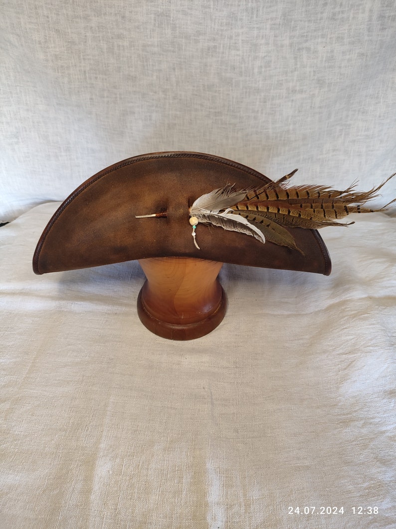 Handmade brown pirate leather hat with wide brim, genuine leather, front view