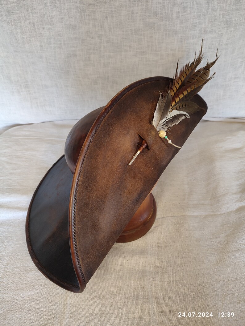 Wide brim pirate leather hat handmade from genuine brown leather, angled view