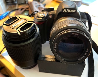 Nikon D3100 Cámara SLR digital con montura F de 14,2 MP con lentes de 18-55 mm y 55-200 mm, trípode, tarjeta de memoria de 16 GB