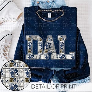 May include: Navy blue sweatshirt with the word "DAD" in a block letter design filled with a football-themed pattern. The sweatshirt has a crew neck and long sleeves. A detail of the print is shown in a circular image.