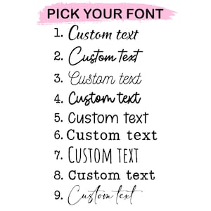 May include: A font selection chart featuring the heading PICK YOUR FONT on a pink brushstroke background. Below are nine numbered lines, each displaying the phrase Custom text in a distinct typeface, ranging from script to sans-serif.