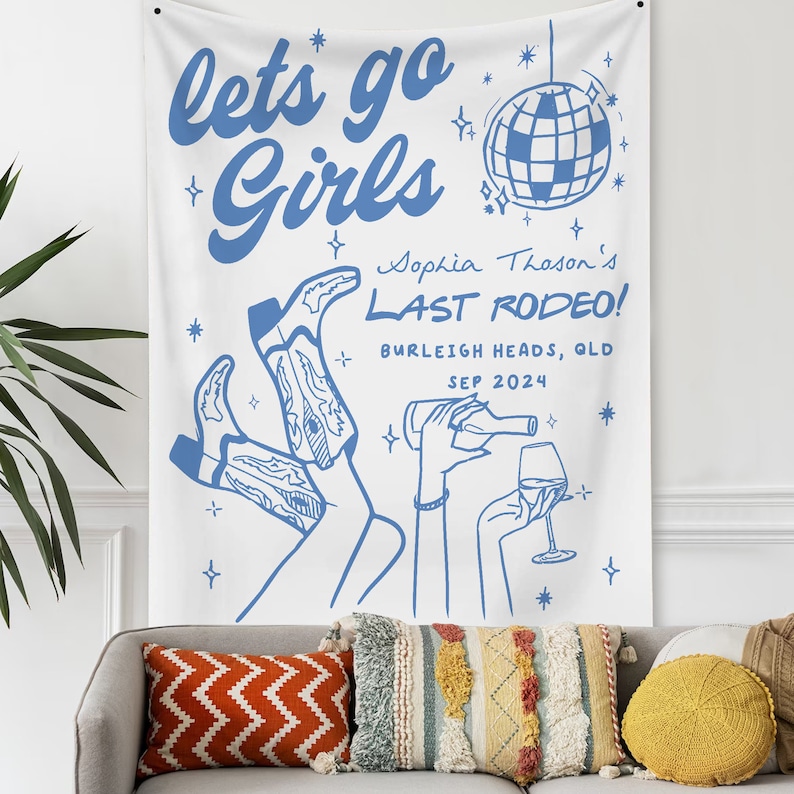 May include: A white banner with blue text and illustrations. The text reads "lets go Girls Sophia Thoson's LAST RODEO! BURLEIGH HEADS, QLD SEP 2024". The banner features a disco ball, two pairs of cowboy boots, and a hand holding a glass of wine.