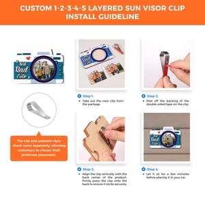 May include: Instructions for installing a layered wooden sun visor clip with a camera design. The clip features the text "Best Dad Ever" and includes a space for a photo. The instructions show how to attach the clip to the visor using double-sided tape.