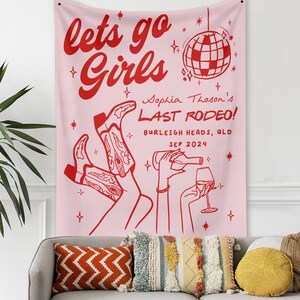 May include: Pink tapestry with the text "lets go Girls" in red. Below the text is a disco ball and the text "Sophia Thoson's LAST RODEO! BURLEIGH HEADS, QLD SEP 2024" in red.