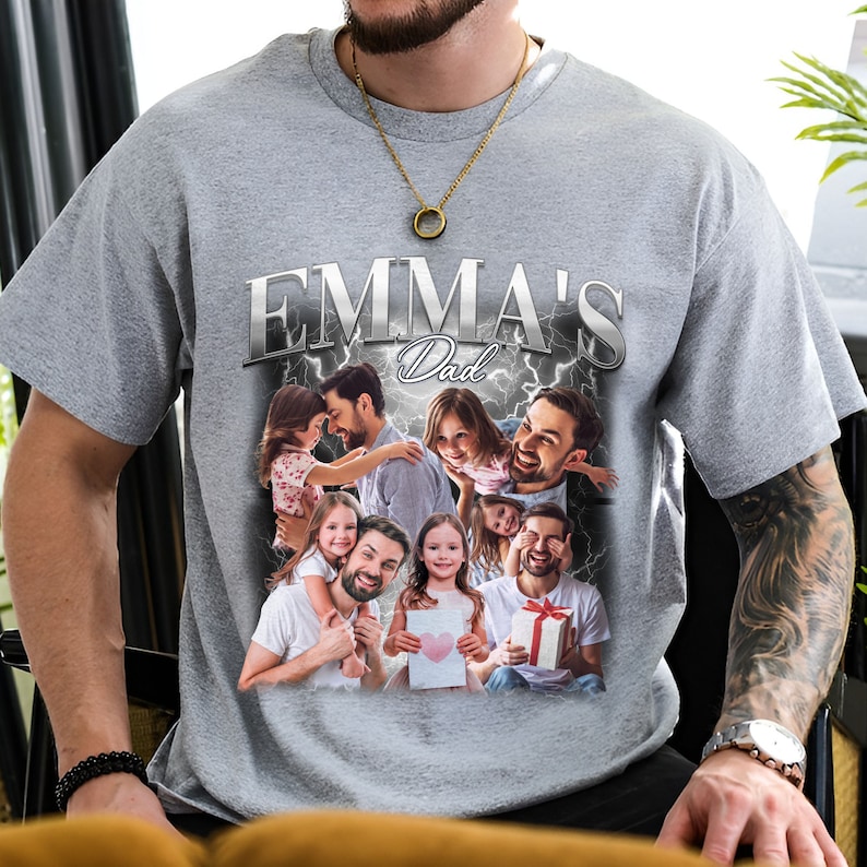 Peut inclure: Un t-shirt gris avec un graphique argent&eacute; qui dit "Emma's Dad" avec un collage de photos d'un homme et d'enfants.