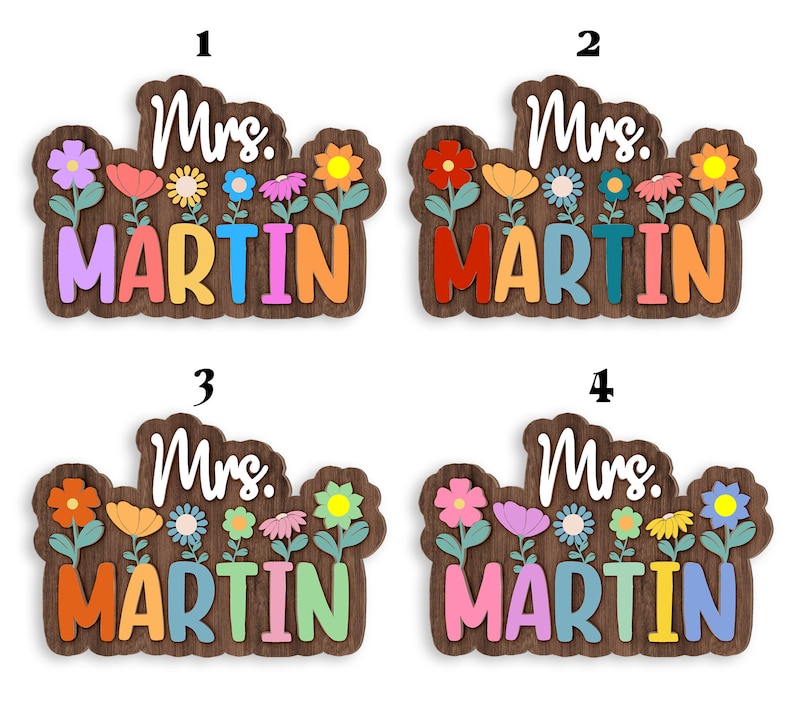 May include: Four wooden signs with the text "Mrs. Martin" in colorful letters. Each sign has a different arrangement of colorful flowers.