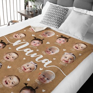 May include: A brown fleece blanket with a white sherpa backing. The blanket features a collage of photos of babies with their names printed below each photo. The names are: Leo, Emily, Noah, Sophia, and a large white "Momma" in the center.