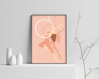 May include: A digital art print featuring a woman in a peachy pink color scheme performing aerial silks. The woman is suspended in the air, her body contorted in a graceful pose. The background is a solid peachy pink color. The print is framed in a black frame.