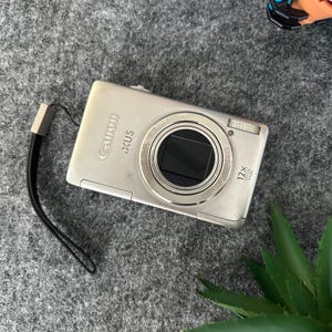 Silver Canon IXUS 1100HS 12.1MP Digital Camera With Battery Charger - Tested & Working!