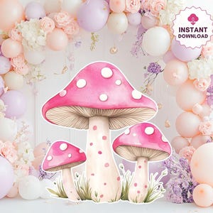 Puede incluir: Ilustración de tres setas rosas con lunares blancos, sobre un fondo de globos pastel y arreglos florales. La imagen tiene un gráfico de "Descarga instantánea", lo que sugiere un producto digital para decoraciones de fiestas o manualidades.