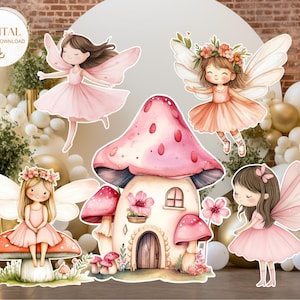 May include: Printable digital cutouts of four fairies and a mushroom house. The fairies are wearing pink dresses with wings and have brown hair. The mushroom house is pink with white accents and has a small door and window. The background is a blurry image of a brick wall and white balloons.