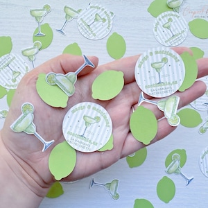 May include: Green and white confetti with a margarita glass and lime design. The confetti says "Margarita & Mayhem" and "Savannah's Bachelorette" with the date "ETS 2024".