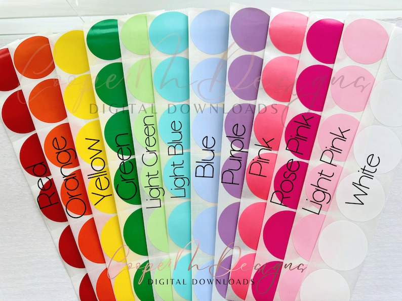 May include: A set of ten round stickers with different colors and labels. The colors are red, orange, yellow, green, light green, light blue, blue, purple, pink, rose pink, light pink, and white. The labels are the same color as the stickers and read "Red", "Orange", "Yellow", "Green", "Light Green", "Light Blue", "Blue", "Purple", "Pink", "Rose Pink", "Light Pink", and "White".