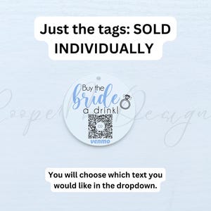 May include: White circular tag with blue text that reads "Buy the bride a drink!" with a QR code and the word "venmo" below. The tag is for sale individually.