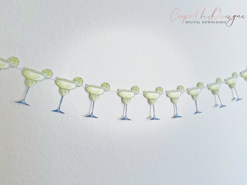 May include: A string of green margarita glasses with lime wedges, perfect for a fiesta or Cinco de Mayo party.