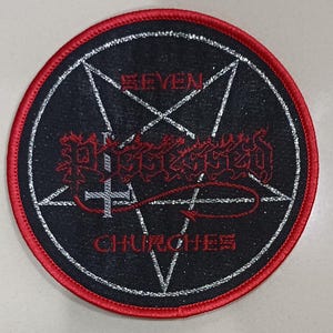 May include: Round black patch with a red border. The patch features a white pentagram design with the words "SEVEN CHURCHES" and the word "POSSESSED" in red, gothic-style lettering. A white cross is also present.