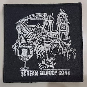 May include: A set of three ceramic mugs with a speckled, matte finish. The mugs are in shades of cream, light gray, and dark gray. Each mug has a simple, minimalist design and a rounded handle. The mugs are likely for coffee or tea.