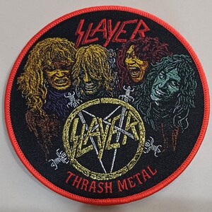 May include: Round black patch with a red border featuring the band Slayer. The patch has a central Slayer logo with the words "THRASH METAL" below. The image includes illustrations of the band members with long hair.