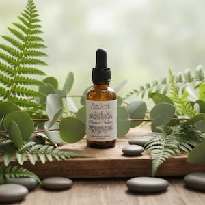 May include: A white ceramic mug with a black handle and the text "But First, Coffee" in a black, bold font. The mug is on a white surface. The mug is approximately 4 inches tall.