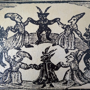 May include: Black and white illustration of figures dancing in a circle. The figures include horned demons and people in long robes and hats, all holding hands. The artwork has a vintage, antique aesthetic.