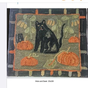 May include: A square rug featuring a hooked fiber design titled Hide and Seek 25x29i. The scene depicts a large black cat and a smaller black cat among orange pumpkins and green foliage on a muted green background, framed by a dark border.