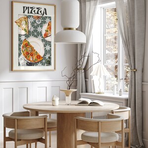 May include: A round wooden dining table with four chairs. The table has a fluted base and the chairs have light brown upholstery. A framed poster with the word "Pizza" and a depiction of pizza slices is hanging on the wall behind the table.