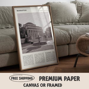 May include: A framed monochrome print depicting a building with columns and a fountain, labelled "Manhattan" and "Founded: 1754". The print is displayed on a wooden floor. The print is advertised as premium paper and available as canvas or framed.