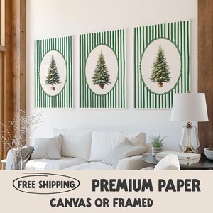 May include: Three framed art pieces featuring Christmas trees. Each piece has a green and white striped background with an oval frame. The oval frames contain a detailed illustration of a Christmas tree in a pot. The text on the bottom says "PREMIUM PAPER CANVAS OR FRAMED".