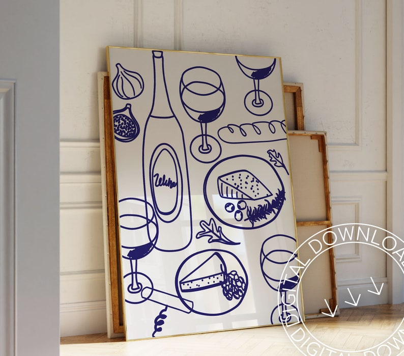 May include: A white framed print with a blue illustration of a bottle of wine, glasses of wine, cheese, bread, and grapes. The illustration is in a doodle style.