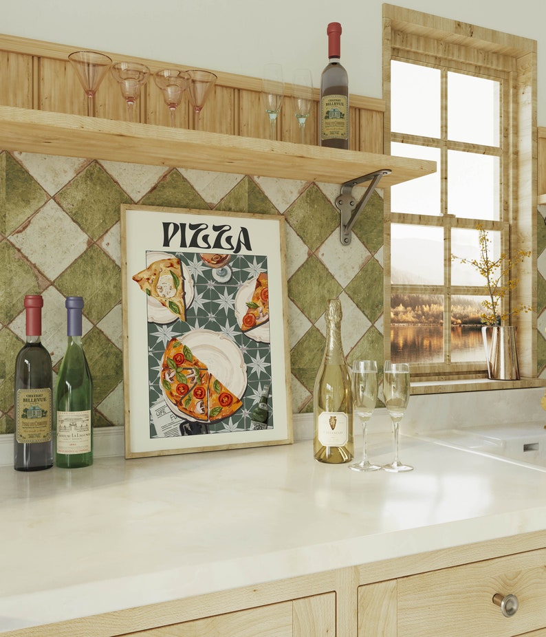 May include: A framed print of a vintage pizza advertisement with the word "PIZZA" in bold letters. The print features three slices of pizza on plates with a green and white tiled background.