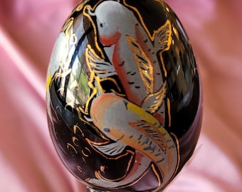 Fenton glass black egg signed and numbered, hand-painted with koi fish pattern, on stand