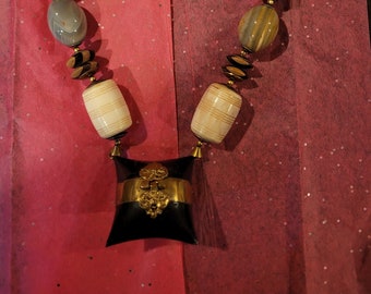 Unusual vintage beaded necklace with brass pendant with secret compartment