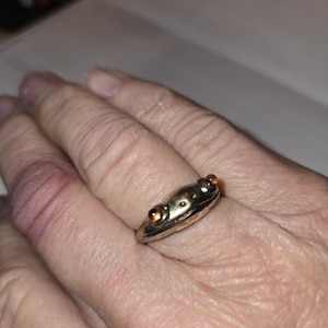 Tibetan silver fertility frog ring, size 9 (adjustable), red garnet eyes