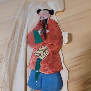 Antique traditional silk clothed Cinese paper doll; Chung Li Ch-uan, one of the 8 Immortals in Chinese Taoist Mythology.