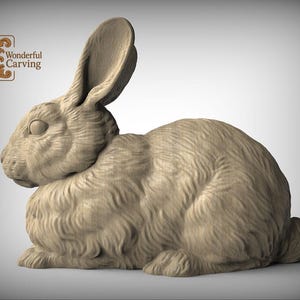 A wooden carving of a rabbit sitting on its hind legs.