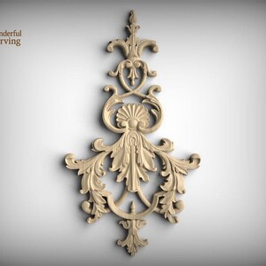 May include: A light-colored wooden decorative carving featuring intricate symmetrical scrollwork, acanthus leaf motifs, and a central shell element. The design includes the text Wonderful Carving in the upper left corner of the image.