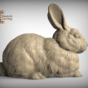 A wooden carving of a rabbit sitting on its hind legs.